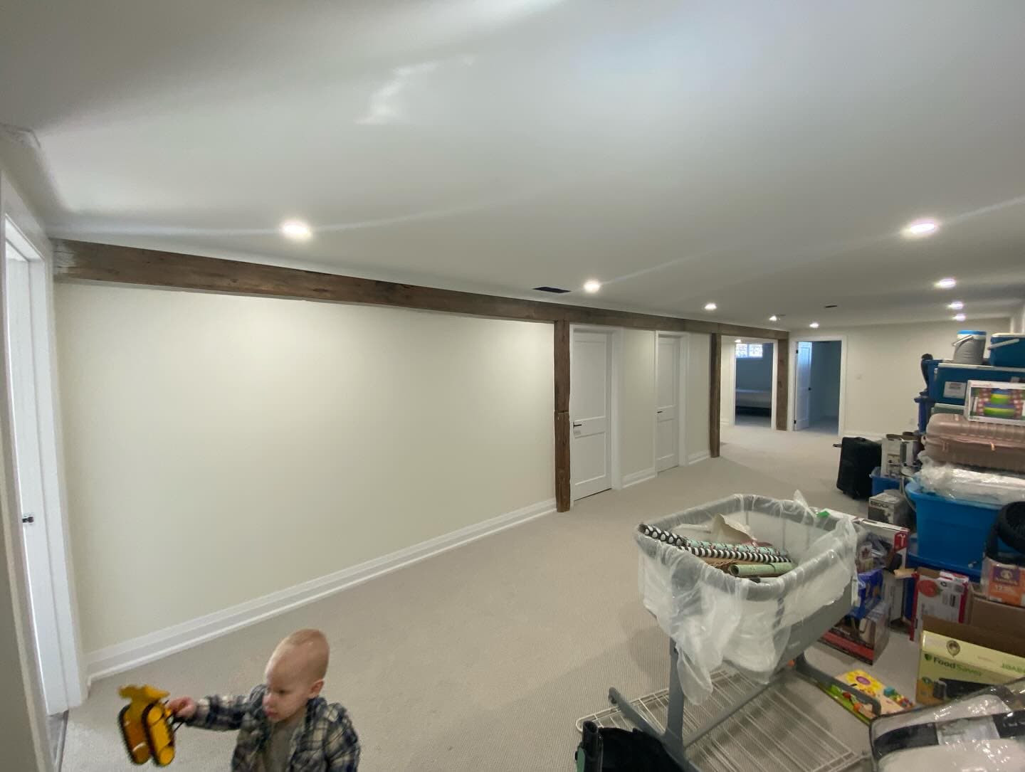 Basement painting - bright white finish with wood beams